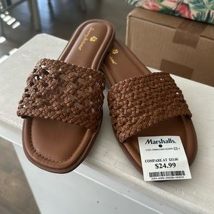 Dark tan causal slip on sandal.
